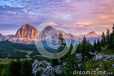 Panoramic view of famous Dolomites mountain peaks glowing in beautiful golden evening light at sunset in summer, South Tyrol, Stock Photo