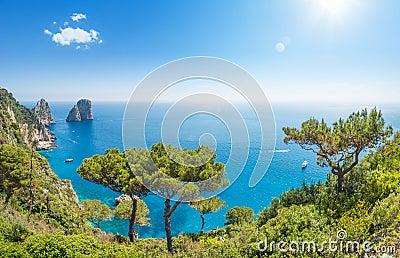 Panoramic view of famous Faraglioni rocks from Capri island, Italy Stock Photo