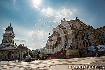 Panoramic view of famous Gendarmenmarkt square with Berlin Concert Hall and German Cathedral in golden evening light at sunset Editorial Stock Photo