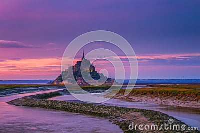 Panoramic view of famous Le Mont Saint-Michel tidal island at sunset, Normandy, northern France Stock Photo