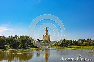 Panoramic view of Giant sitting Buddha against tropical landscape Stock Photo