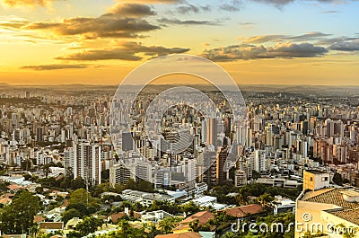 Panoramic view of golden sunset in city Belo Horizonte , Brazil . Stock Photo