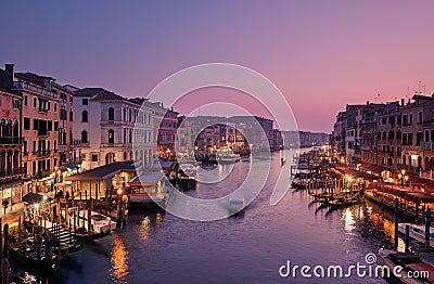 Venice, Italy - February 18, 2020: Panoramic view of Grand canal from Rialto Bridge during sunset.Ponte di Rialto is one of the Stock Photo