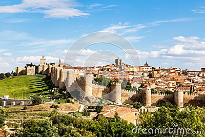 Panoramic view of the historic city of Avila from the Mirador of Cuatro Postes, Spain, with its famous medieval town walls Stock Photo