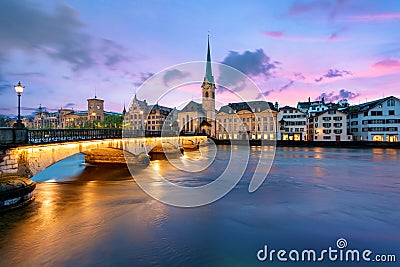 Panoramic view of historic Zurich city center with famous Fraumunster Church and river Limmat at Lake Zurich , in twilight, Canto Stock Photo