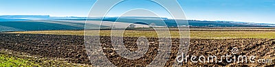 Panoramic view of lines on big ploughland field Stock Photo