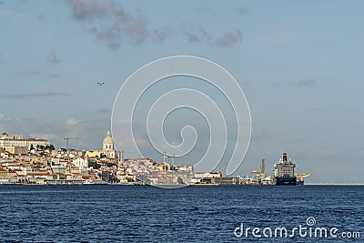 Panoramic view of Lisbon with cruise ship moored and passing through Portugal with tourists Editorial Stock Photo