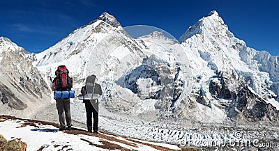 Mount Everest from Pumo Ri base camp with two tourists Editorial Stock Photo