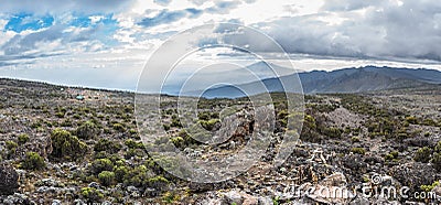 Panoramic view of Mount Meru and the Shira Cave Camp site on the Machame hiking route on Mt Kilimanjaro, Tanzania Stock Photo