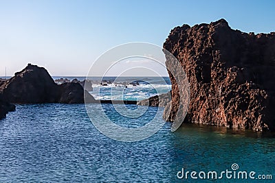 Porto Moniz - Panoramic view of natural lava swimming pools Piscinas Naturais Velhas in coastal town Porto Moniz, Madeira island Stock Photo