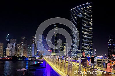 Panoramic view at night of Business Bay district with reflection in sea, UAE. Aerial sky at highest buildings in central Editorial Stock Photo