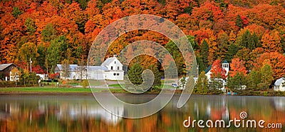 Panoramic view of old barn by the lake with fall foliage near Danville, Vermont Stock Photo