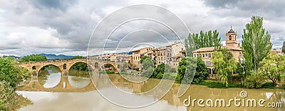 Panoramic view at the old Romanesque Bridge over Arga river in Puente La Reina - Spain Stock Photo