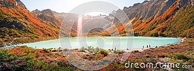 Panoramic view over Esmeralda lagoon and magical austral forest, and high mountains in Tierra del Fuego National Park, Patagonia, Stock Photo