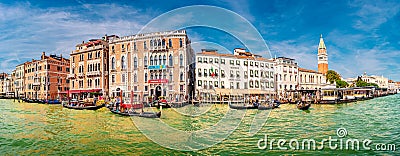 Panoramic view over magical sunset with tourists in Venice, piers, promenade embankment and many gondolas near Doge Palace and Editorial Stock Photo