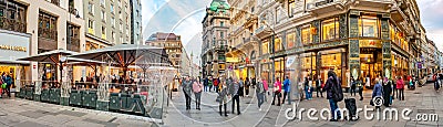 Panoramic view over warm sunset in busy with tourists famous Graben shopping and restaurant street near Stephans square Editorial Stock Photo