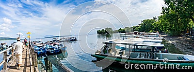 Panoramic view of a pontoon with colored balinese umbrellas Editorial Stock Photo