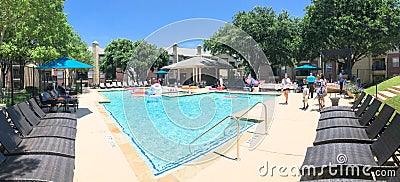 Panoramic view resident pool party event at apartment complex near Dallas, Texas Editorial Stock Photo