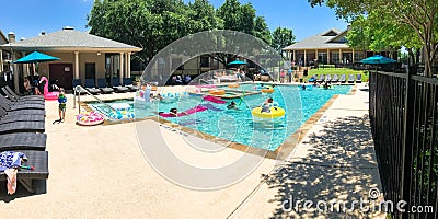 Panoramic view resident pool party event at apartment complex near Dallas, Texas Editorial Stock Photo