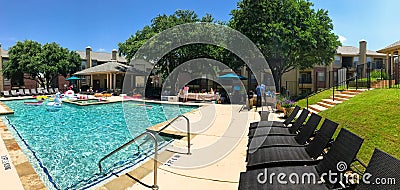 Panoramic view resident pool party event at apartment complex near Dallas, Texas Editorial Stock Photo