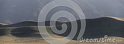 Rolling hills at Carrizo national monument under evening sunlight Stock Photo