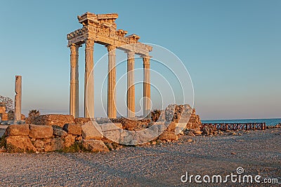 Panoramic view of ruins of ancient Temple of Apollo in Side on sunset, Alanya province, Turkey. Ruined old city. Unesco Stock Photo