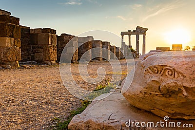 Panoramic view of ruins of ancient Temple of Apollo in Side on sunset, Alanya province, Turkey. Ruined old city. Unesco Stock Photo
