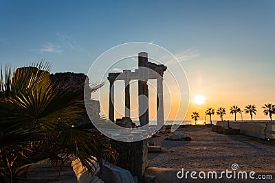 Panoramic view of ruins of ancient Temple of Apollo in Side on sunset, Alanya province, Turkey. Ruined old city. Unesco Stock Photo