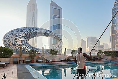 Panoramic view of Sheikh Zayed road with Museum of Future, high-rise towers and swimming pool. Black African American Editorial Stock Photo