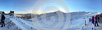Panoramic view of ski resort, slope, people on the ski lift, skiers on the piste in Valle Nevado Editorial Stock Photo