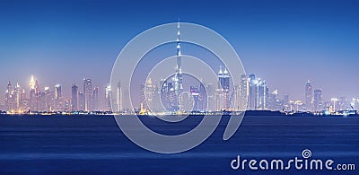 View of the skyline of the futuristic city of Dubai with all the familiar outlines of skyscrapers. Vacation and real Stock Photo