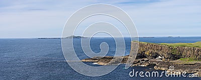 Panoramic view on Staffa Island and Fingals Cave or The Giants Causeway off the coast of Scotland Stock Photo