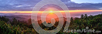 Panoramic view of sunrise with mist and mountain at Doi Pha Hom Pok, the second highest mountain in Thailand, Chiang Mai, Thailand Stock Photo