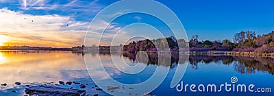 Panoramic view of sunset with beautiful skyline over lake Zorinsky Omaha Nebraska Stock Photo