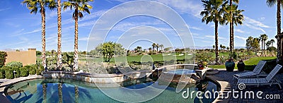 Panoramic view of swimming pool, hot tub and golf course Stock Photo