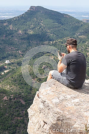 Panoramic View Of Tourist On Mountain Peak Stock Photo
