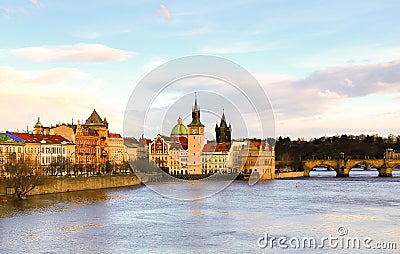 Panoramic view of the tower with a clock on the river vatslav mala strana part of the stone bridge. Prague Czech Republic March Editorial Stock Photo