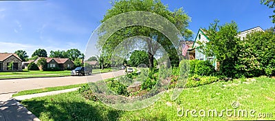 Panoramic view typical Texas residential neighborhood with single story house, sidewalk and green lawn Stock Photo
