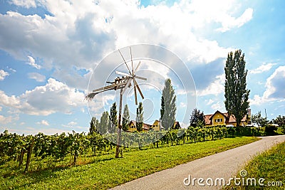 Panoramic view at vineyards with Klapotetz pinwheel before harvest, South Styrian wine route, Austria Stock Photo