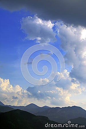 Western Tatra Mountains with Czerwone Wierchy peaks under a cloudy sky seen from Zakopane in Poland Stock Photo