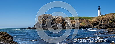 Panoramic view of Yaquina Head Lighthouse, view from Cobble beach in Oregon state Stock Photo