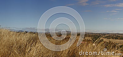 panoramic views of dry grassy drought stricken farm Stock Photo