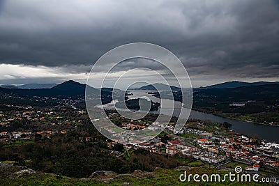 Panoramic of Vila Nova de Cerveira. Vila Nova de Cerveira, top of the mountain view over Minho River and Caminha at sunset. Stock Photo