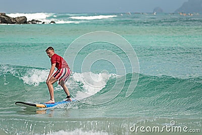 10/06/2017 Pantau Mawun, Lombok, Indonesia. Young man learns to Editorial Stock Photo