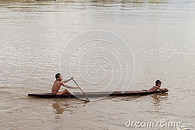 Children on a dugout canoe Editorial Stock Photo