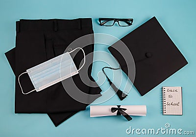 Pants, mask and graduation cap. Stock Photo