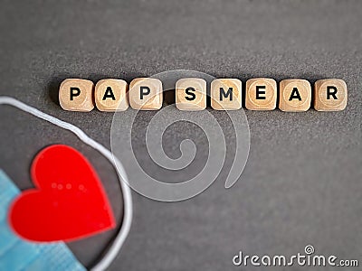 Pap smear text on wooden cubes background. Women health care awareness concept. Stock Photo