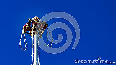 Papantla Flyers or flying pole before jumping with a wonderful blue sky Stock Photo