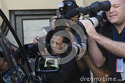 Paparazzi Photographers At Car Window Stock Photo