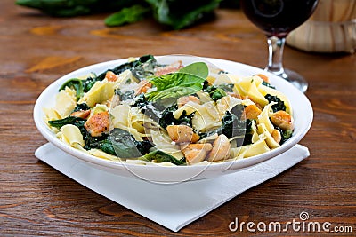 Papardelle with the chicken and with the spinach Stock Photo